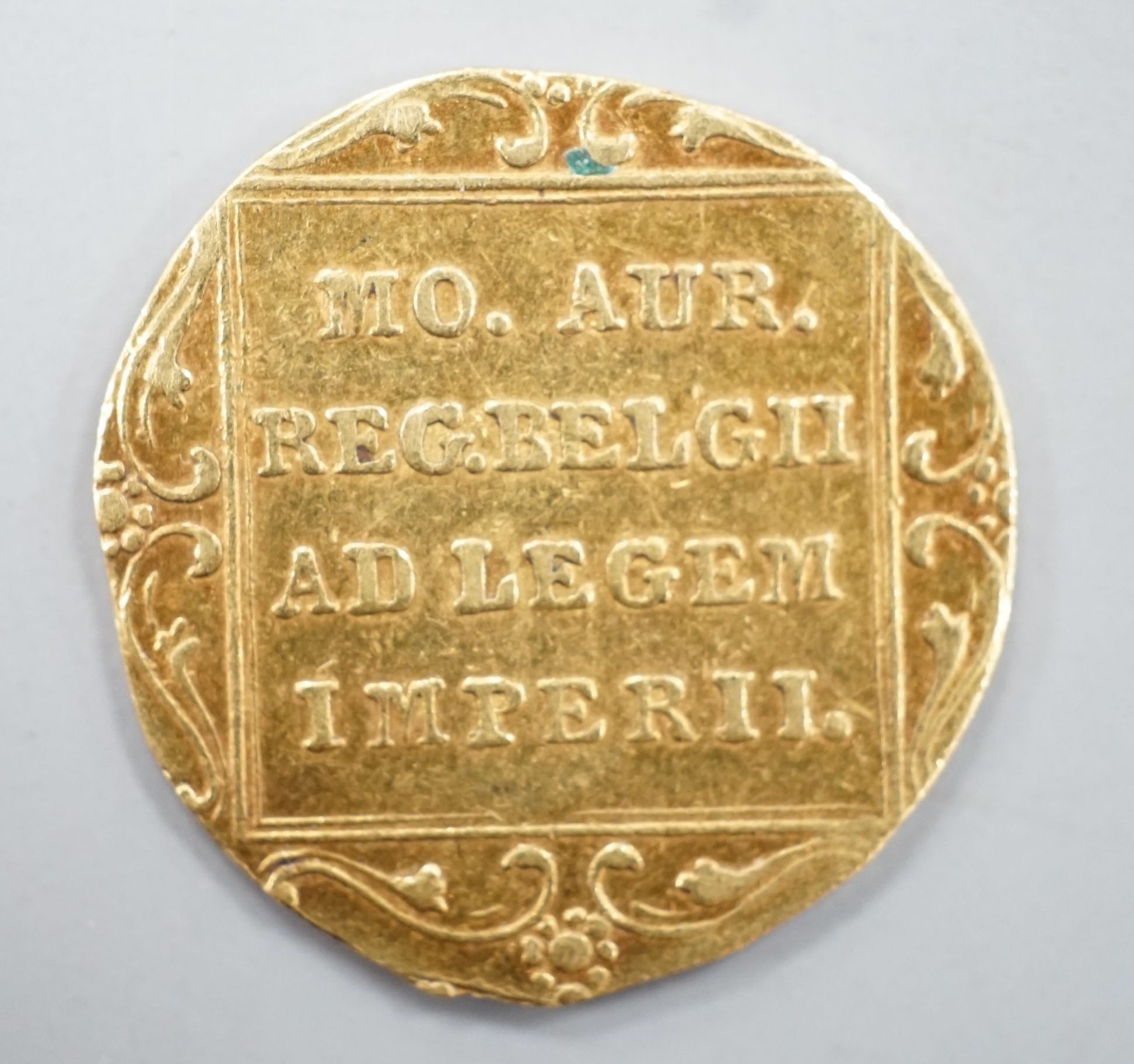 A Netherlands 1831 gold ducat coin.